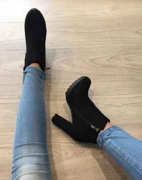 Black suede fringe ankle boots.