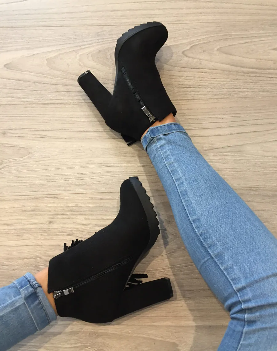 Black suede fringe ankle boots.