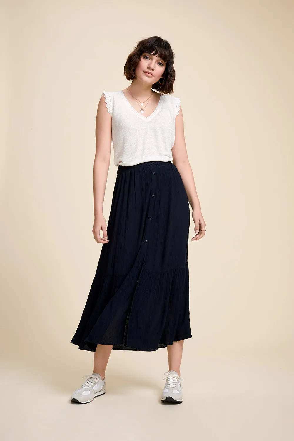 Blue textured and buttoned midi skirt in Java style