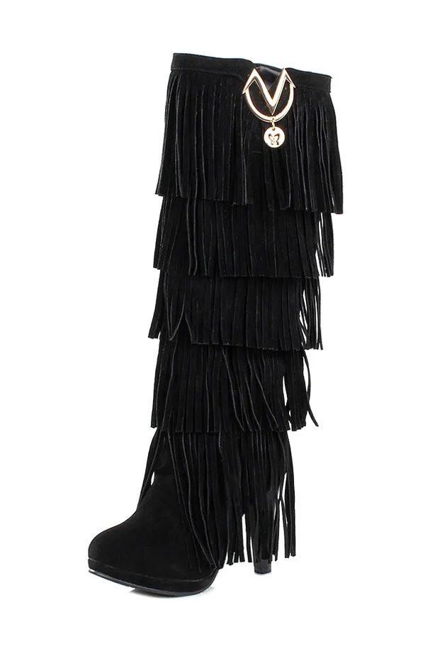 High heel suede boots with fringes.