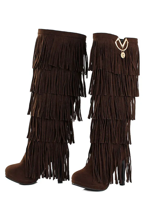 High heel suede boots with fringes.