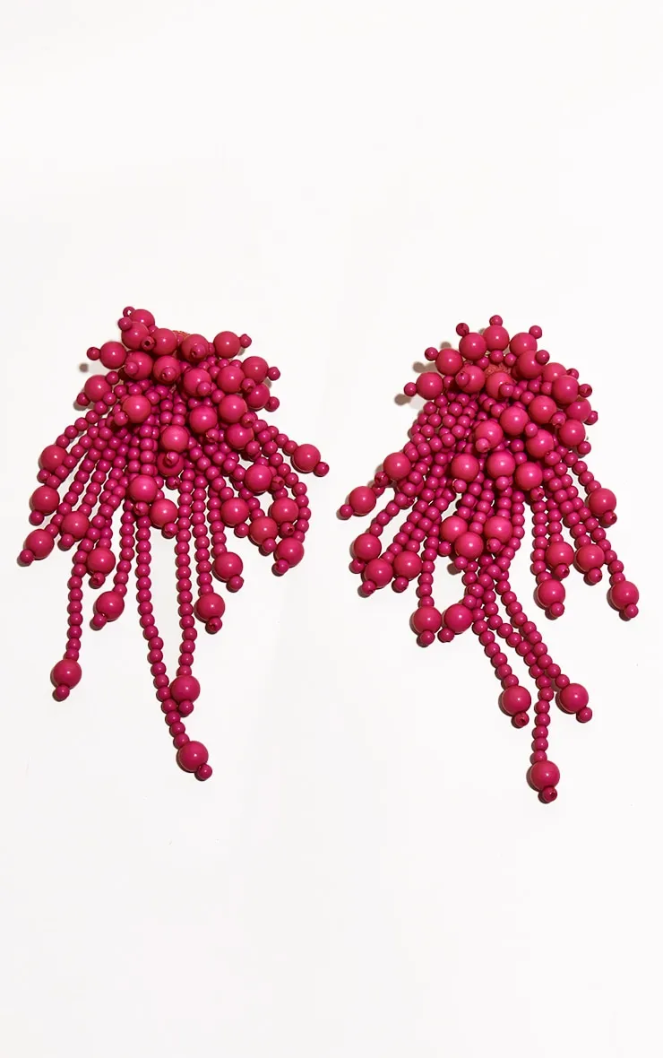 Extra large pink fringe beaded earrings.