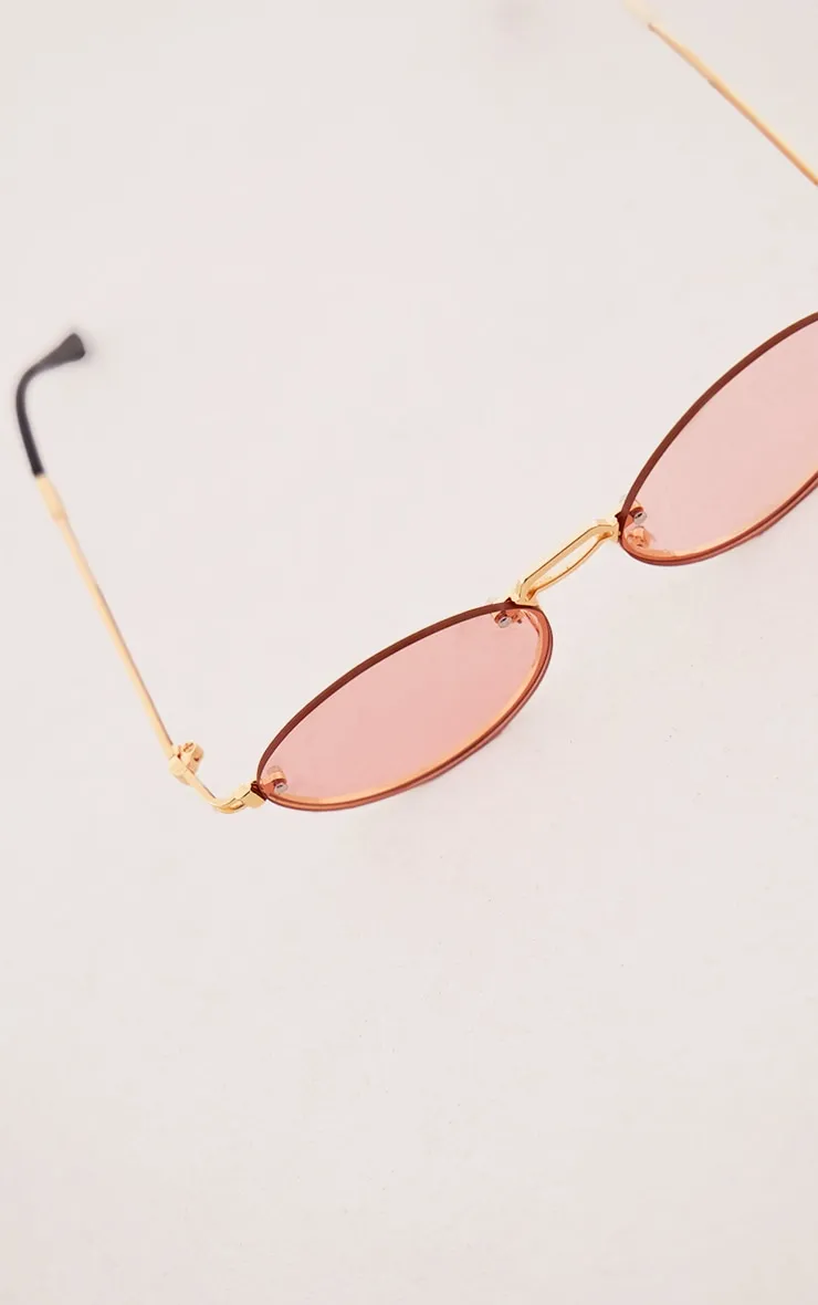 Pink round slim curved sunglasses.