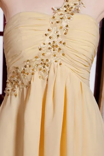 Short Yellow Asymmetrical Evening Dress with Rhinestone Embellishments.