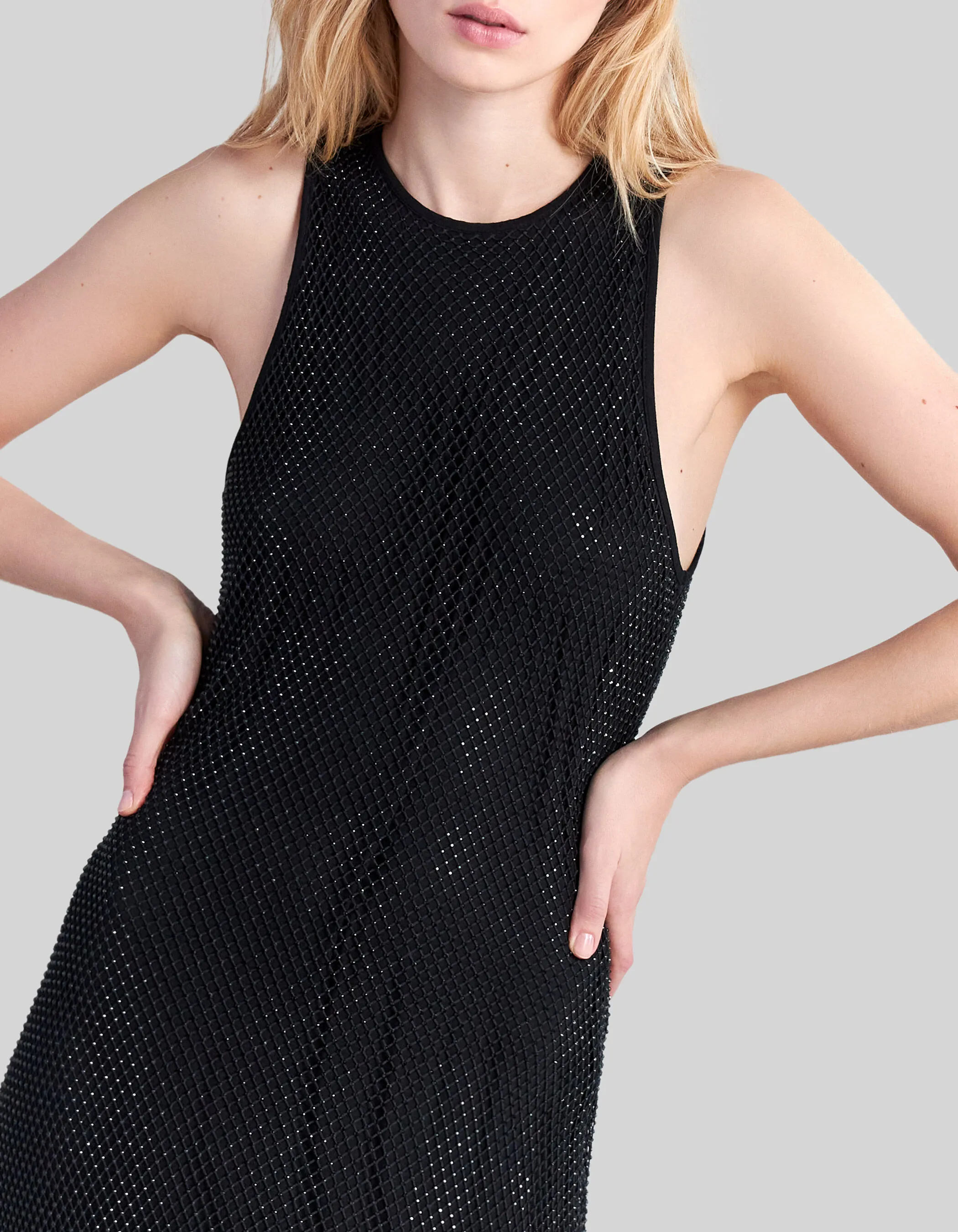 Black midi dress with mesh and rhinestone detail and sheer lining for women.