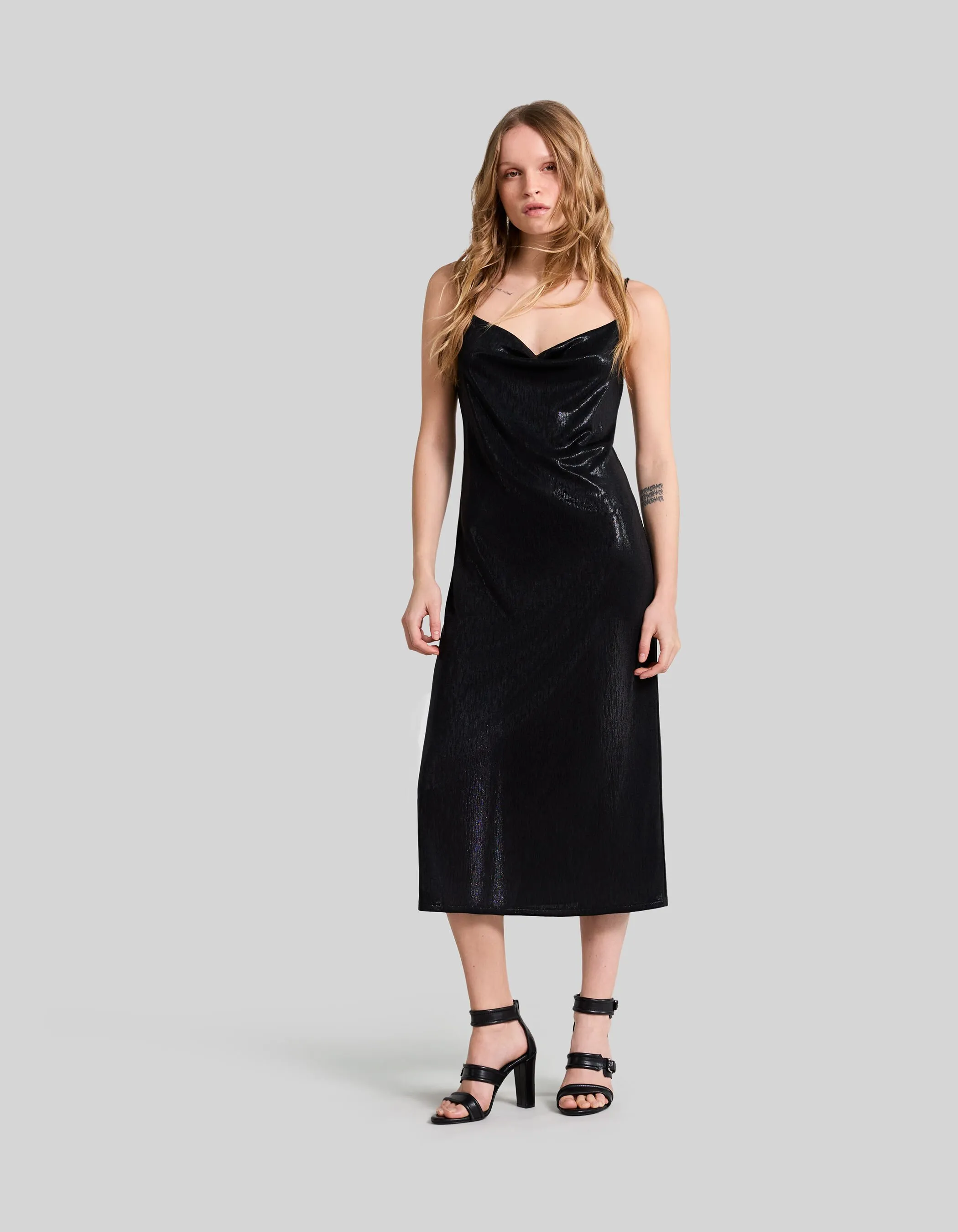 Black shimmery midi dress with thin straps for women.