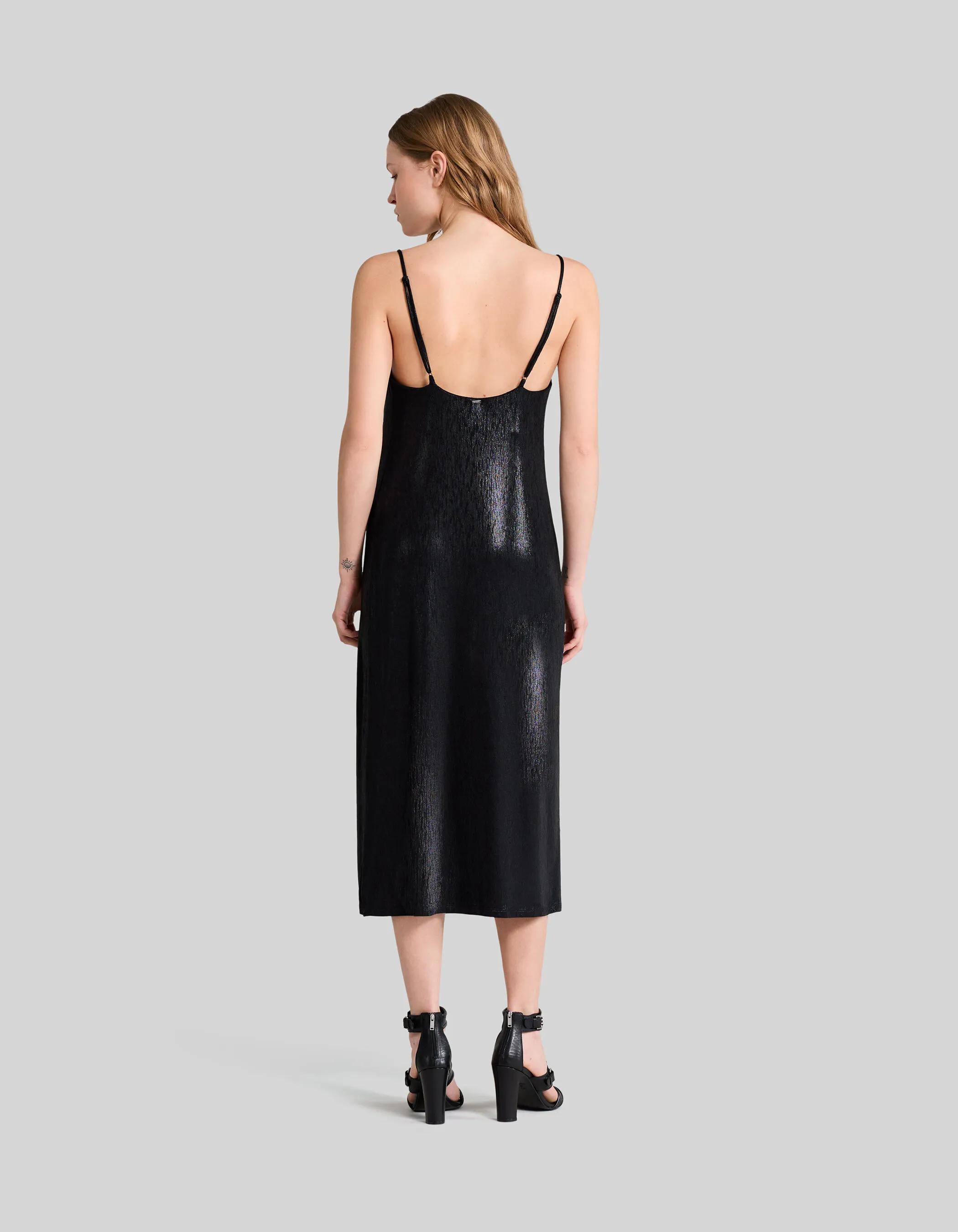 Black shimmery midi dress with thin straps for women.