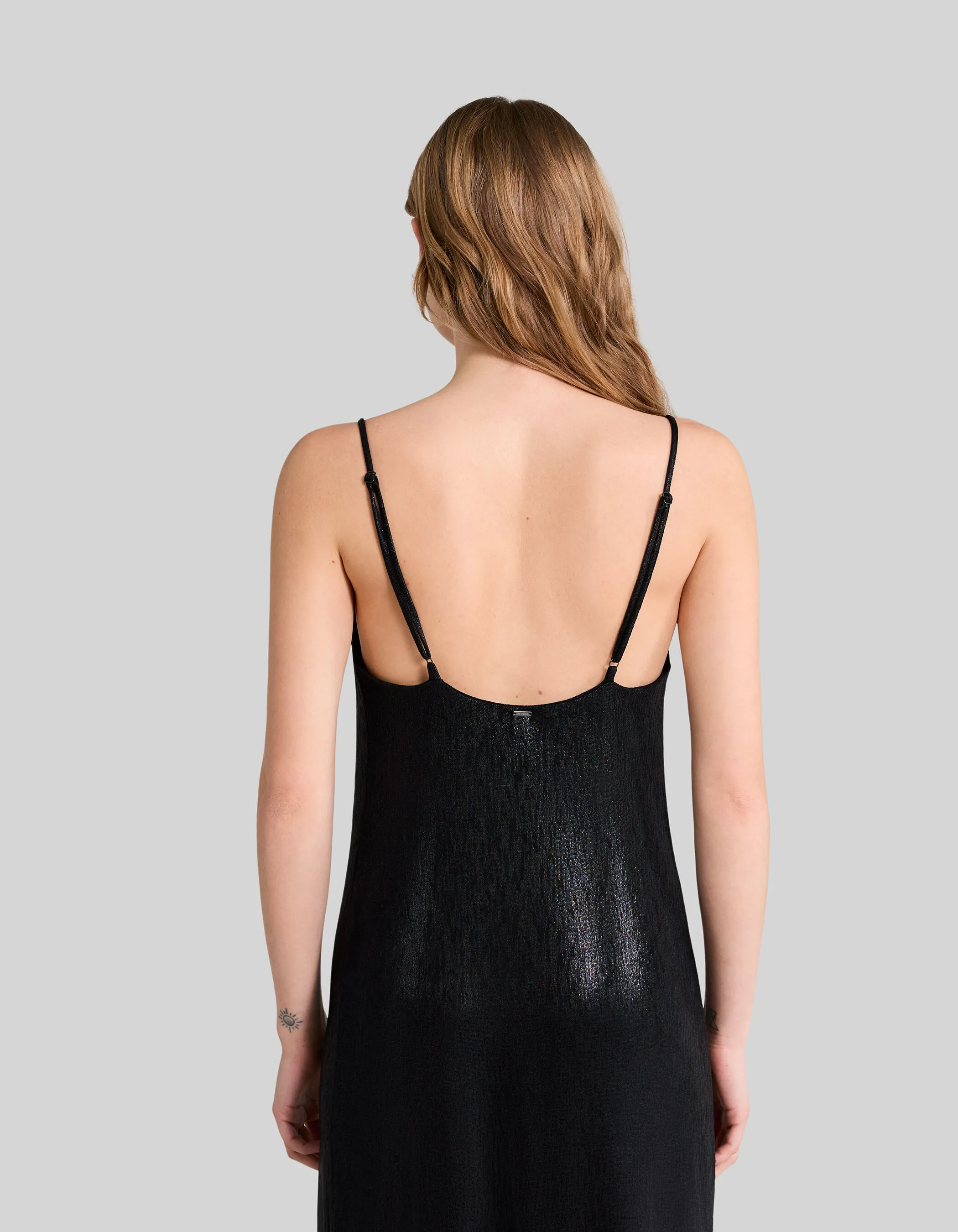 Black shimmery midi dress with thin straps for women.