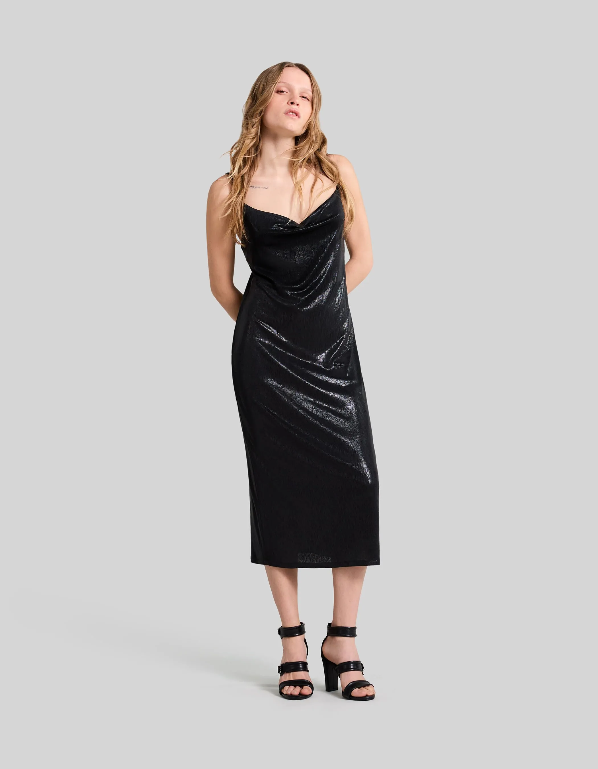 Black shimmery midi dress with thin straps for women.