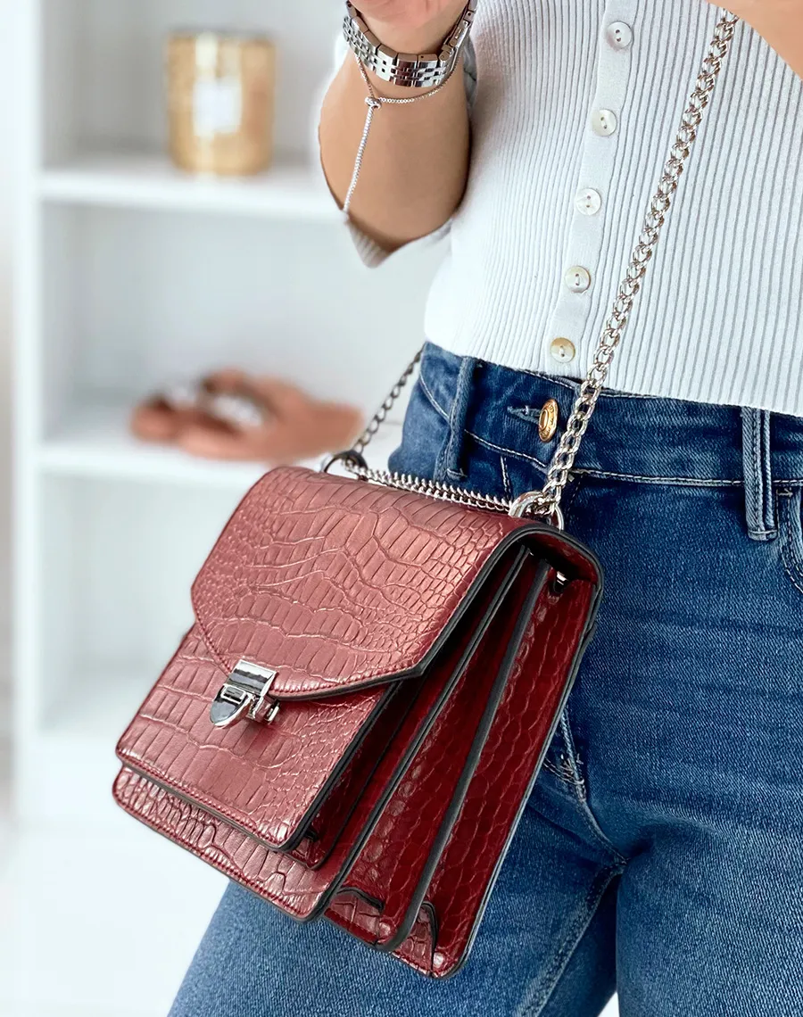 Red croc-effect shoulder bag with silver chain.