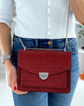 Red croc-effect shoulder bag with silver chain.