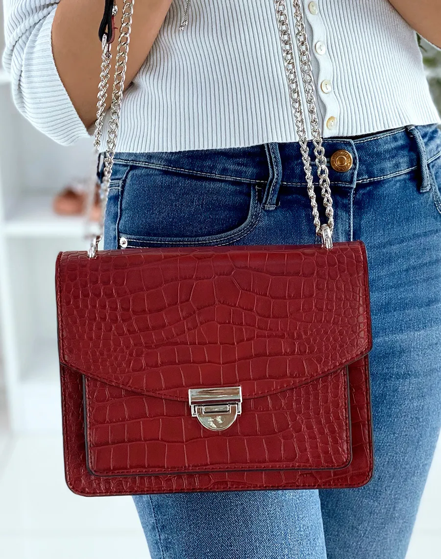 Red croc-effect shoulder bag with silver chain.