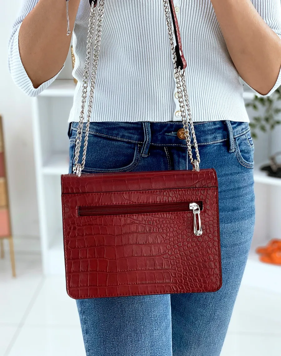 Red croc-effect shoulder bag with silver chain.