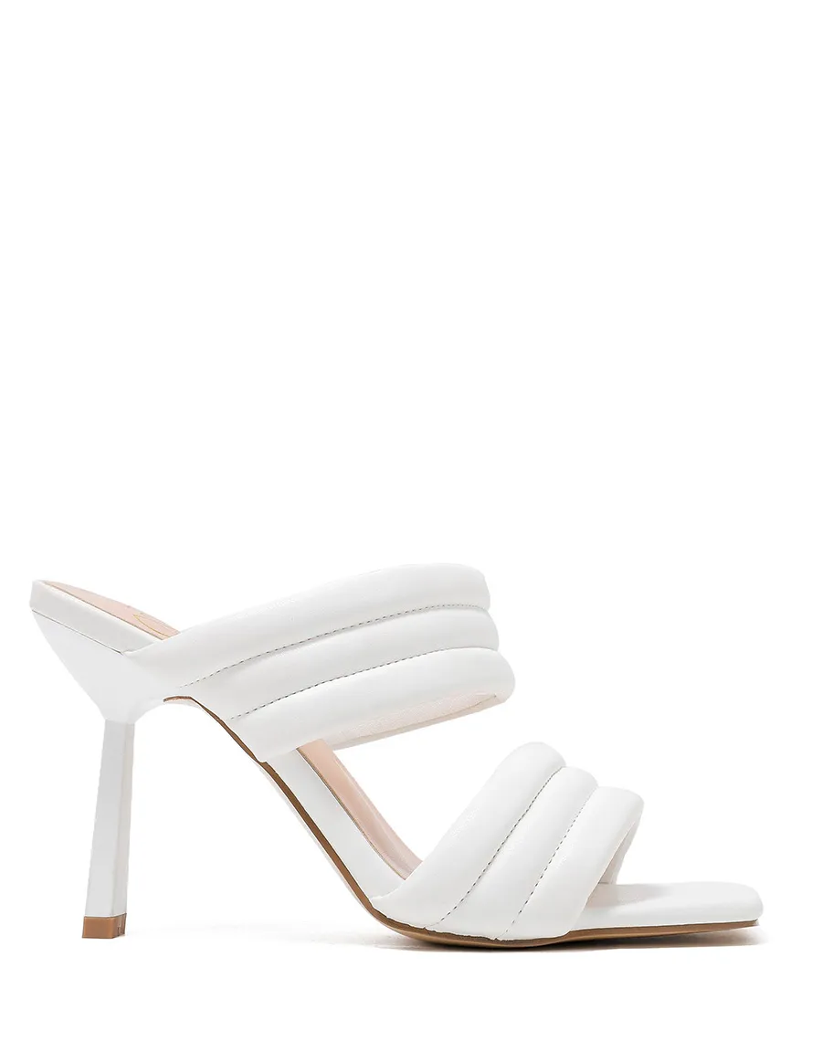 White sandals with thick straps and stiletto heel.