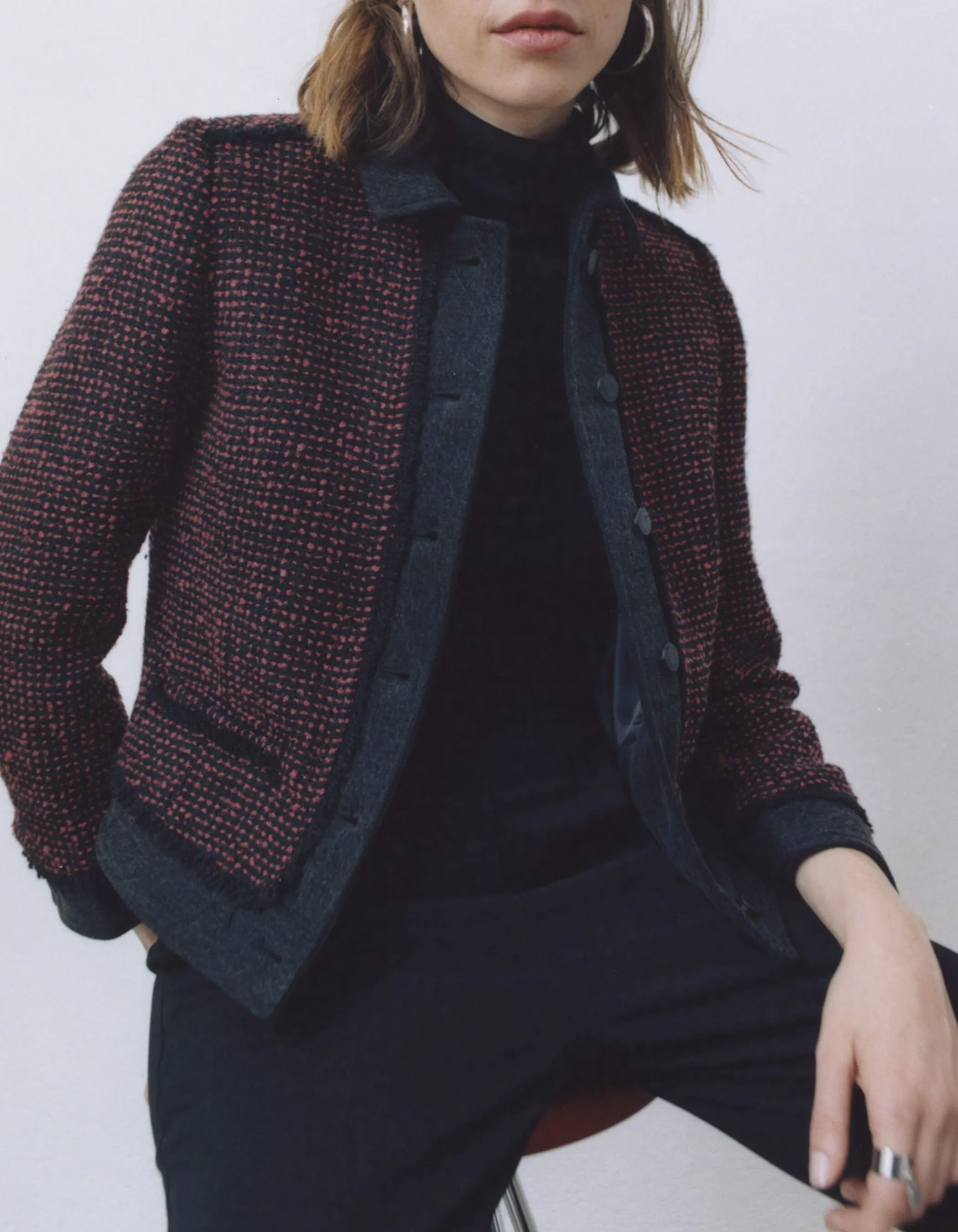 Red and black tweed and denim women's two-tone jacket.