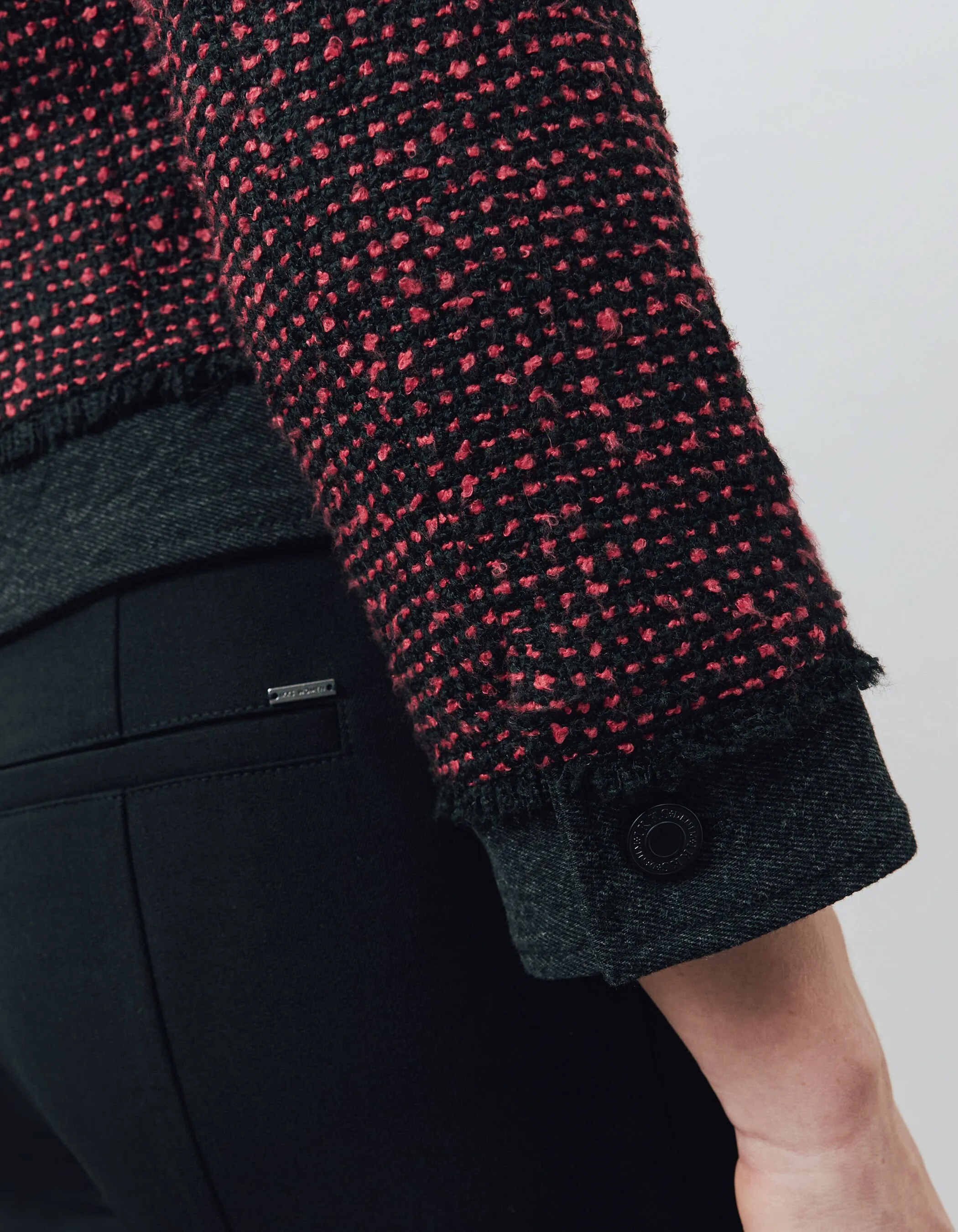 Red and black tweed and denim women's two-tone jacket.