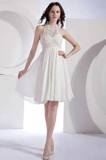 White evening dress with cutout hem.