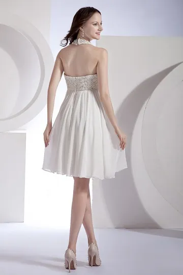 White evening dress with cutout hem.