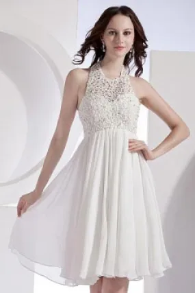 White evening dress with cutout hem.