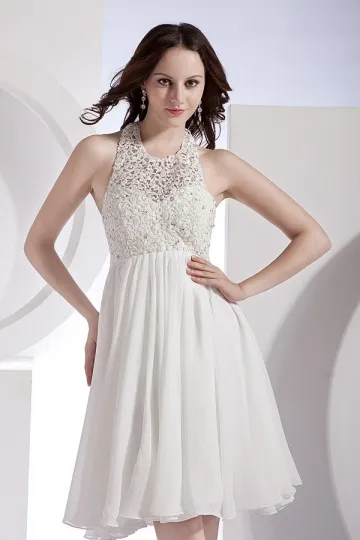 White evening dress with cutout hem.