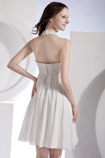 White evening dress with cutout hem.